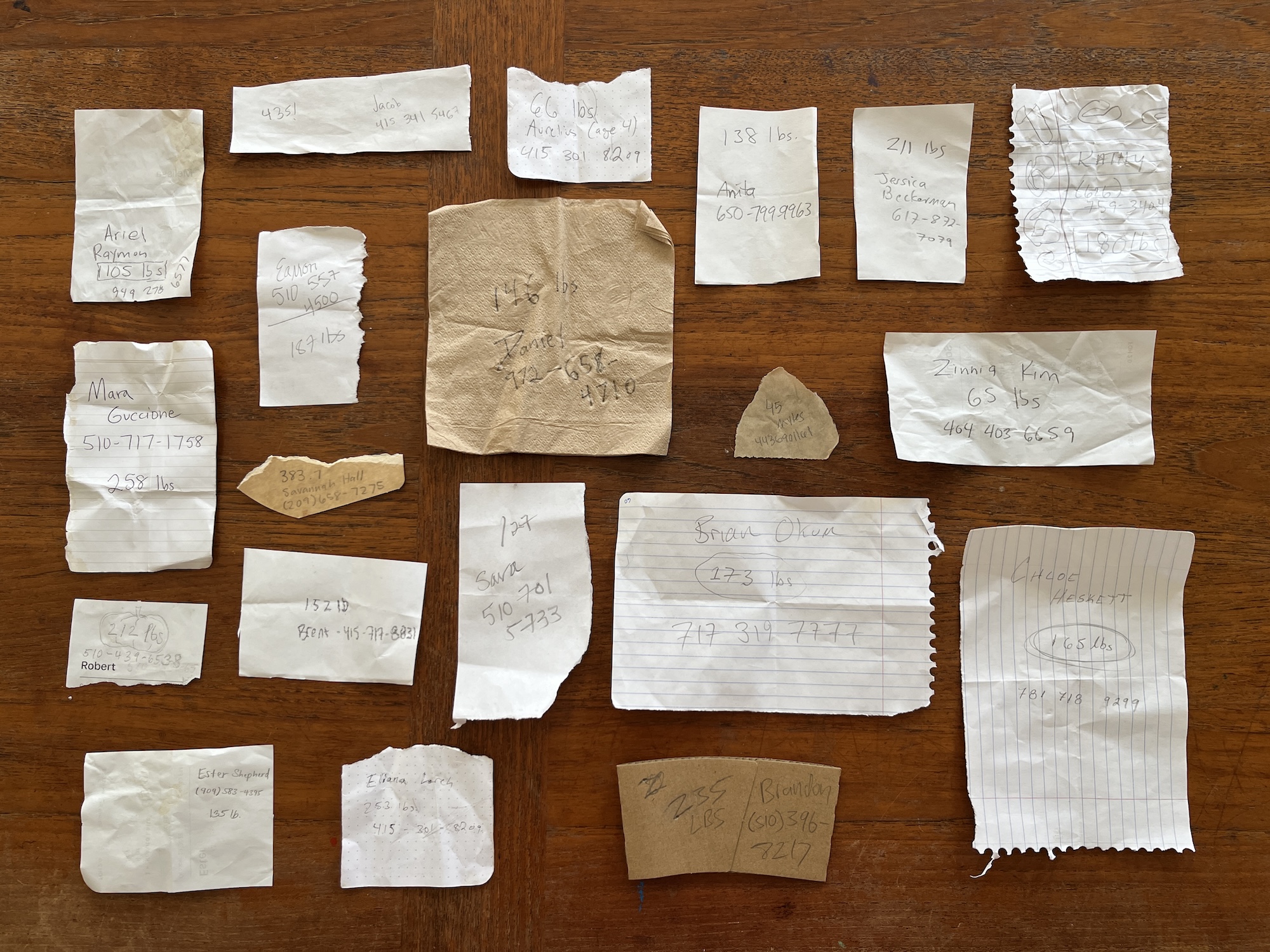 Photo of handwritten pumpkin weight guessing ballots